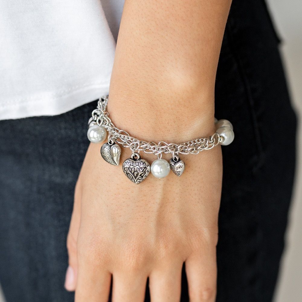 Faux silver charm bracelet with heart and pearl charms